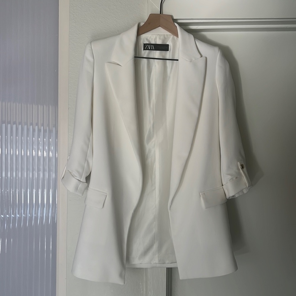 White blazer with rolled up sleeves